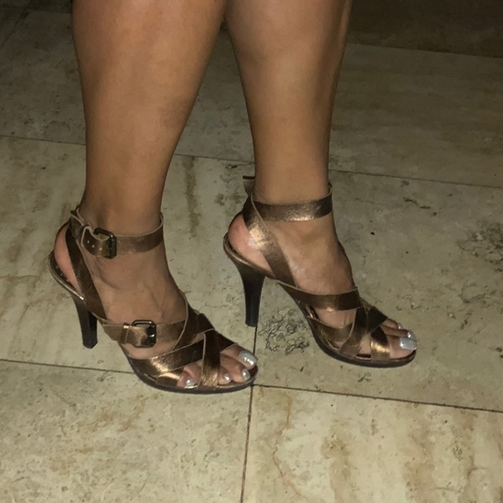 Brown strap heels.